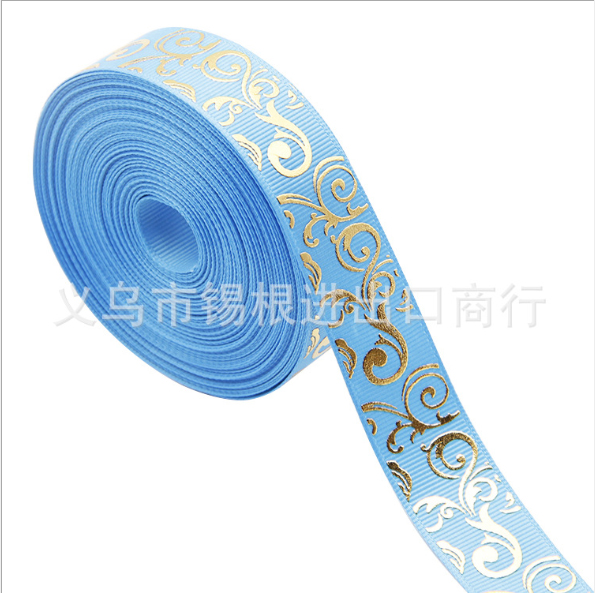 ริบบิ้นผ้าพิมพ์ลายสีฟ้า ลายประกายทองกว้าง 22 mm #BB53