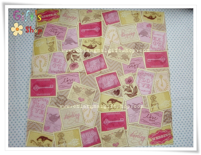 กระดาษแนปกิ้น ลายนกคาบจดหมายตัวสีฟ้า พื้นหลังสีขาว