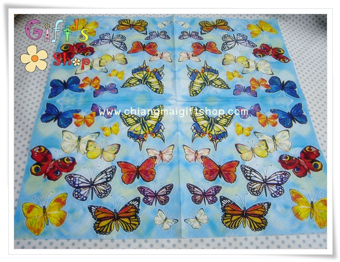 กระดาษแนปกิ้น ลายผีเสื้อสีเหลืองส้มน้ำเงิน แดง ขาว พื้นหลังสีฟ้า